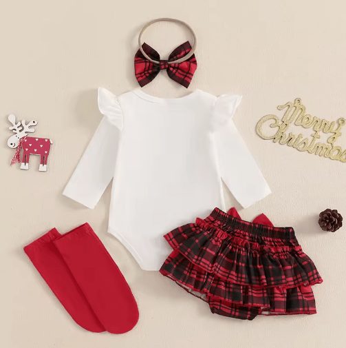 Christmas baby clothes set flat lay with red plaid and holiday design