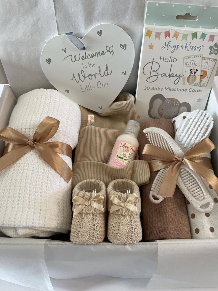Selection of baby shower gifts including newborn essentials, toys, and keepsakes for new parents.
