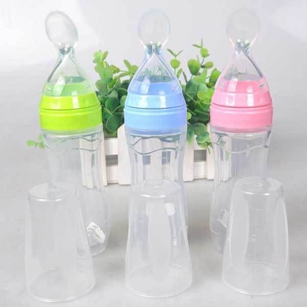 Baby silicone feeding spoon bottle 120ml with squeeze design, ideal for feeding puree and baby food.