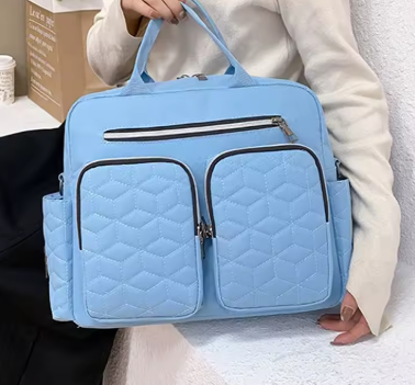 Sky Blue Mom Travel Diaper Bag Backpack with large capacity, waterproof design, and multiple pockets for baby and newborn essentials